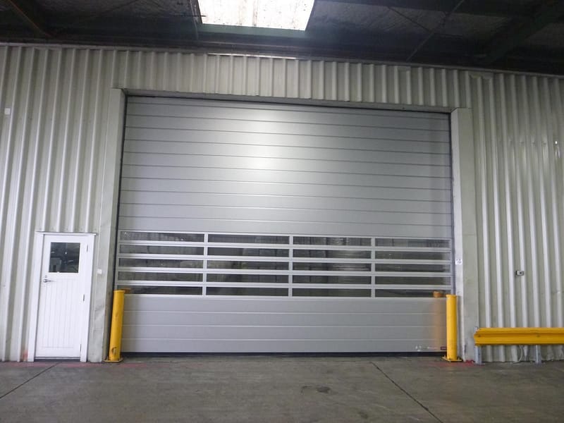 Ulti Spiral Door installed in a corrugated metal warehouse wall